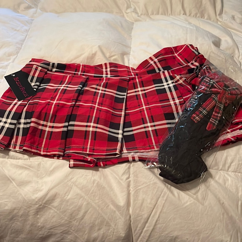 School girl skirt with matching thigh highs . Never worn tag still attached.